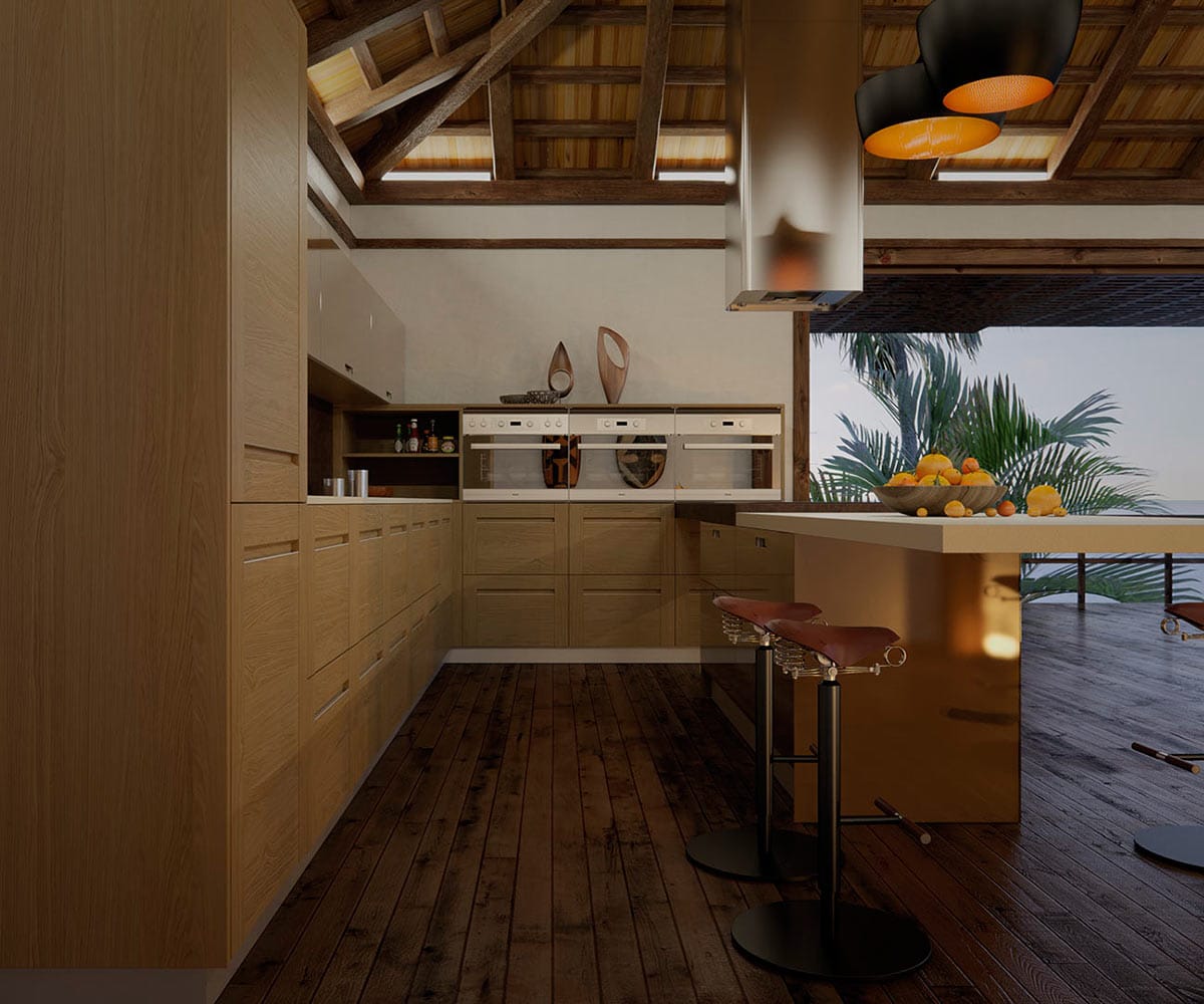 Muebles de diseño para cocina con puertas de acabados en madera y tiradores junto a una isla con un recipiente de frutas sobre ella