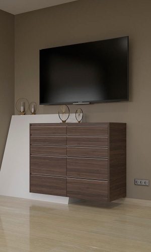 Mueble cajonera de diseño con acabado en madera y detalle geomético en color blanco bajo una televisión